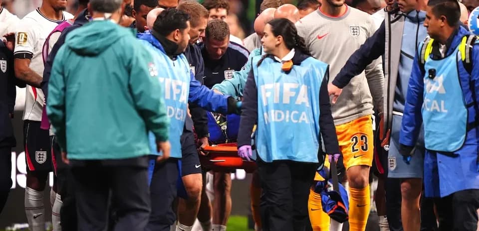 Medical staff transporting injured player off the field