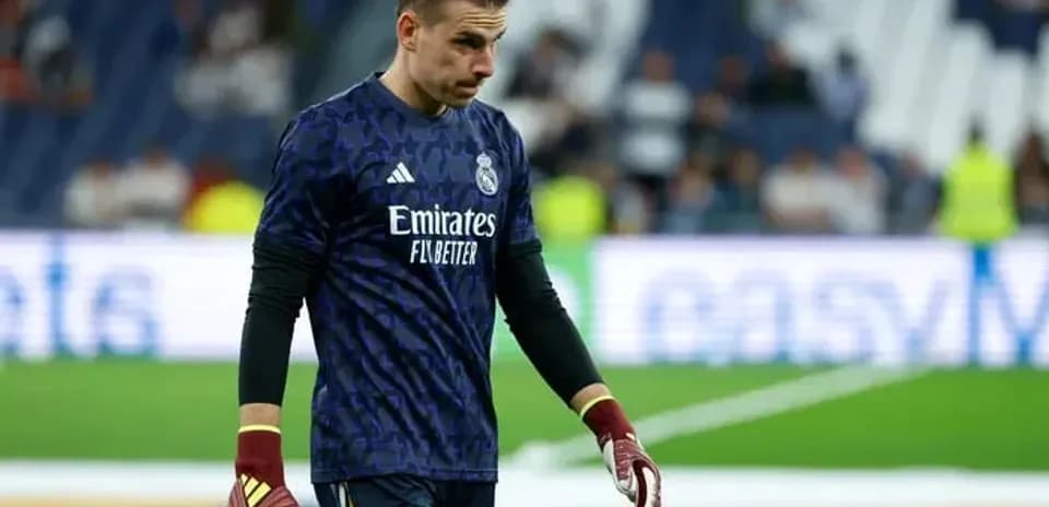 Goalkeeper in Real Madrid kit walking on the field