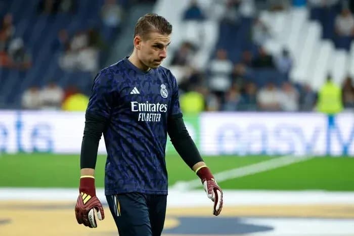 Goalkeeper in Real Madrid kit walking on the field
