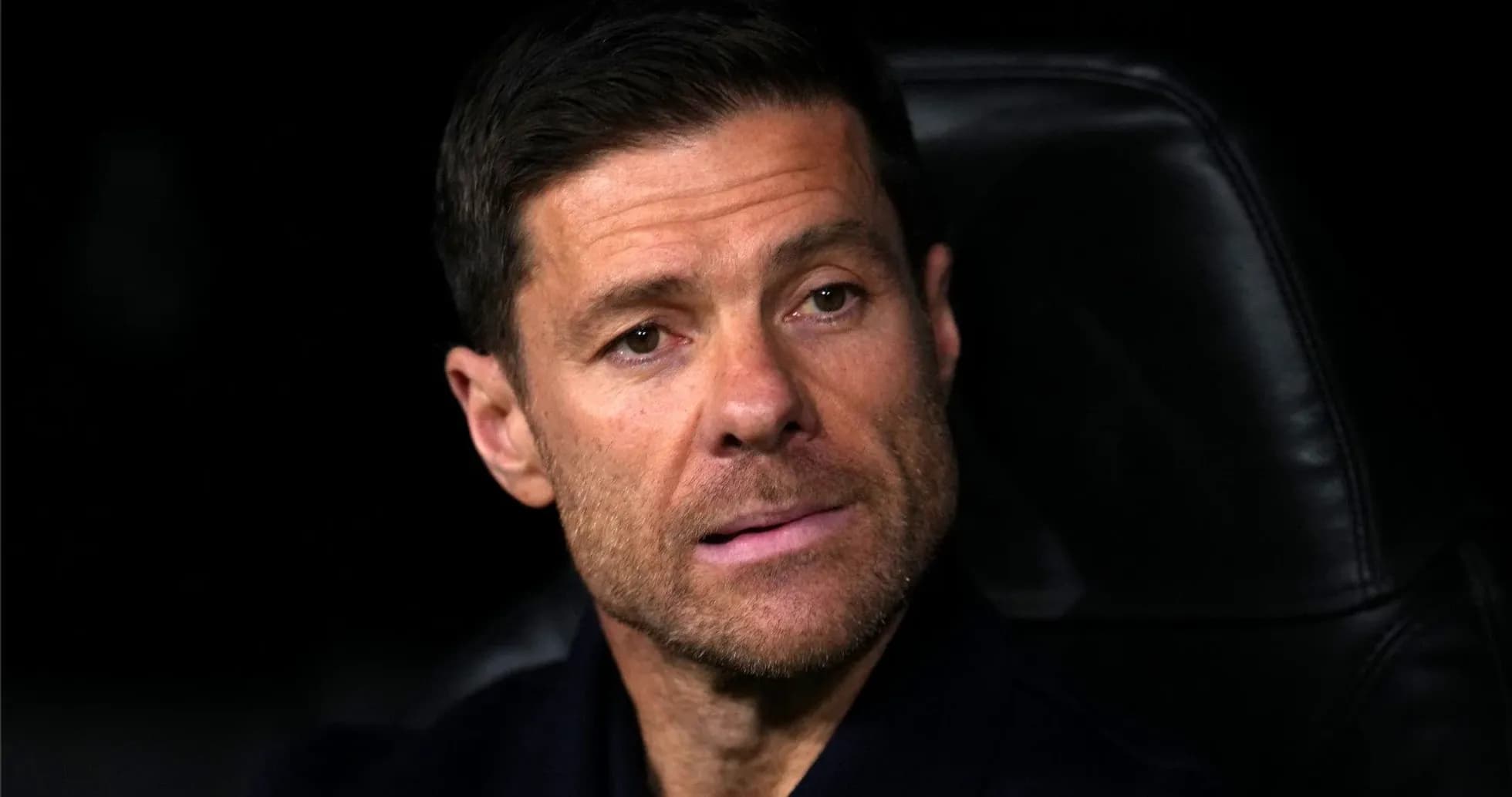 Coach sitting on the bench during a match