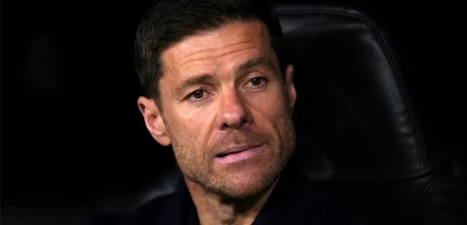 Coach sitting on the bench during a match