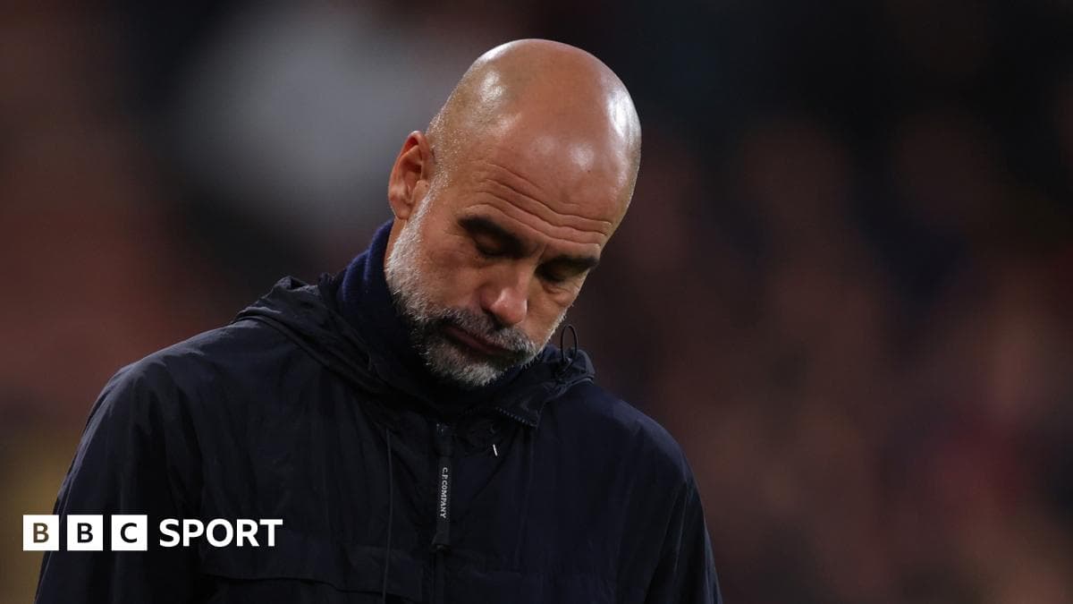 Manager looking down during a match
