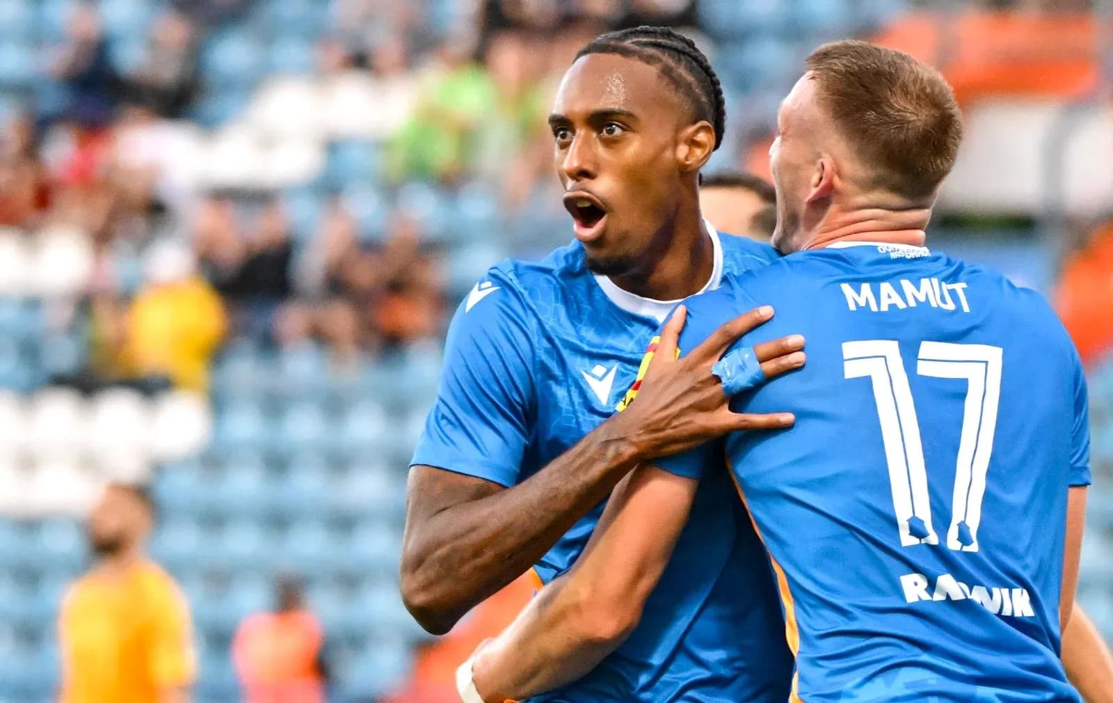 Players celebrating a goal during match