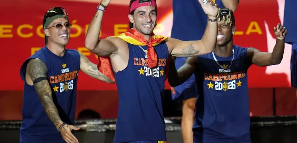 Players celebrating with medals on stage
