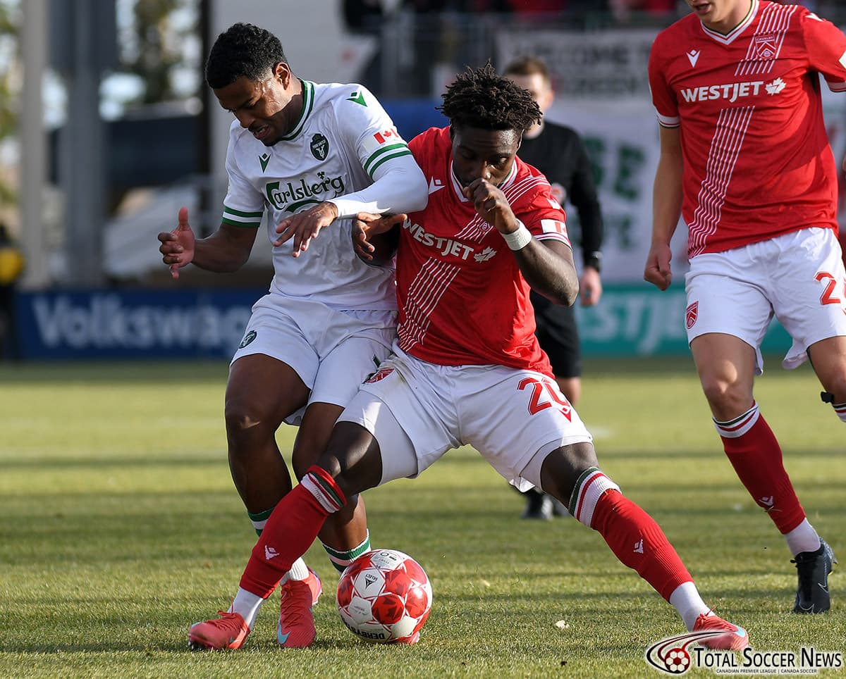 Players competing for the ball during match