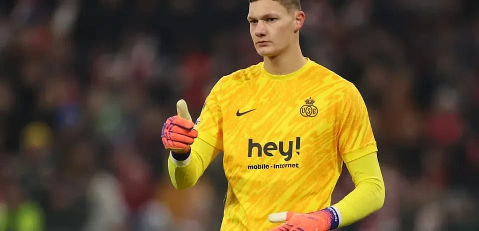 Goalkeeper in yellow jersey giving thumbs up