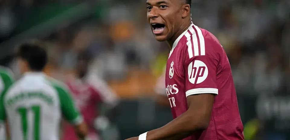Player celebrating during a match in pink kit