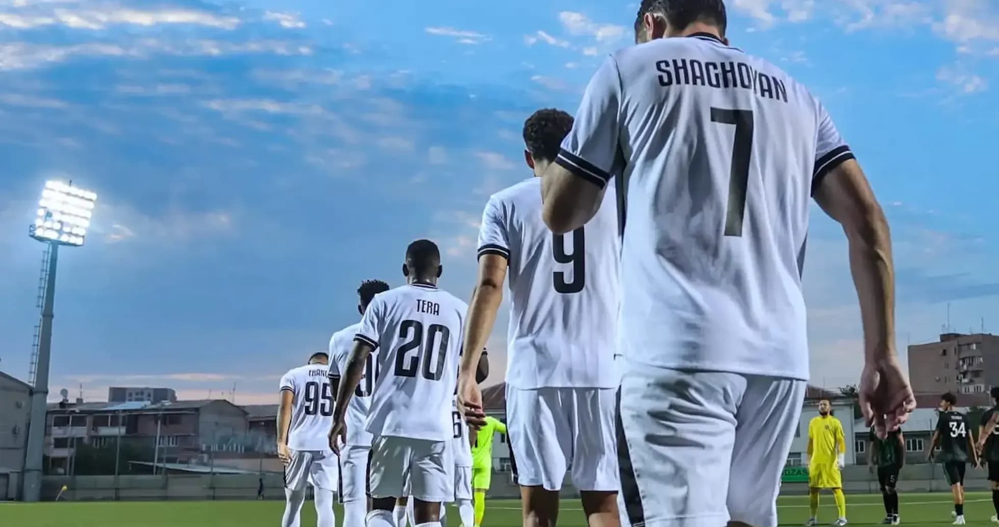 Players walking onto the field for match