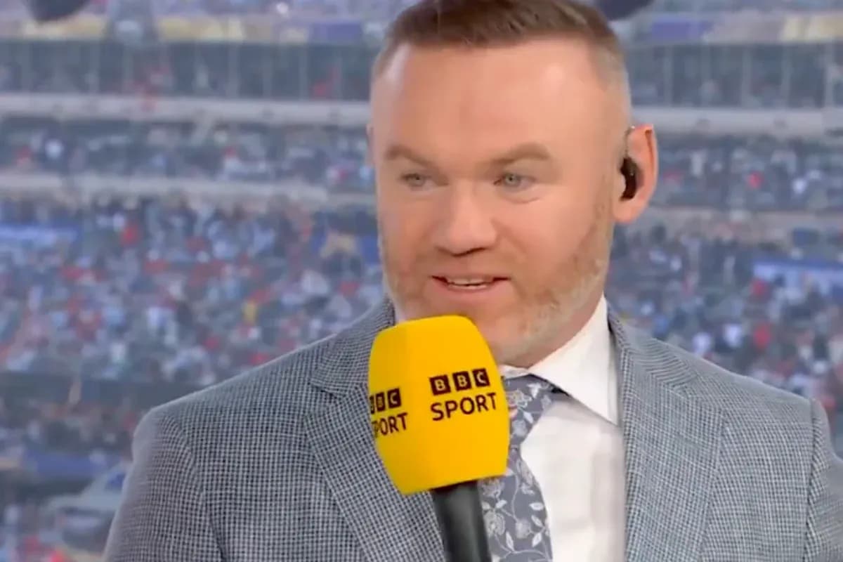 Sport analyst speaking into microphone during broadcast