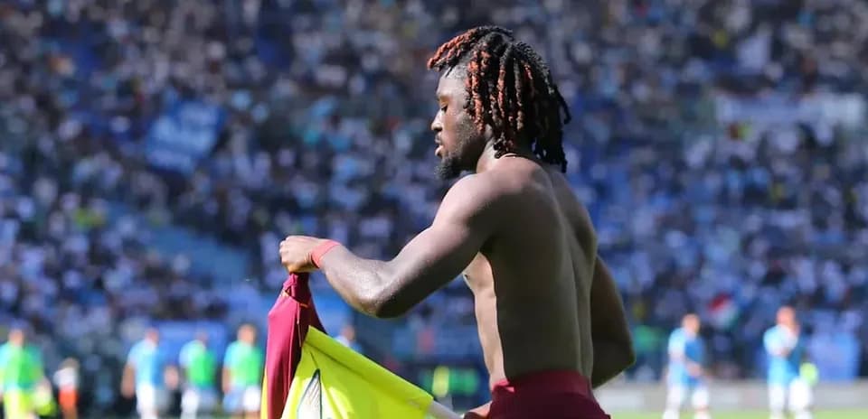 Player removing jersey during match in stadium