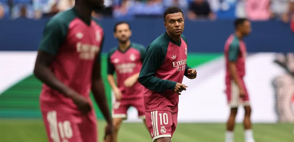 Players warming up in training kits before match