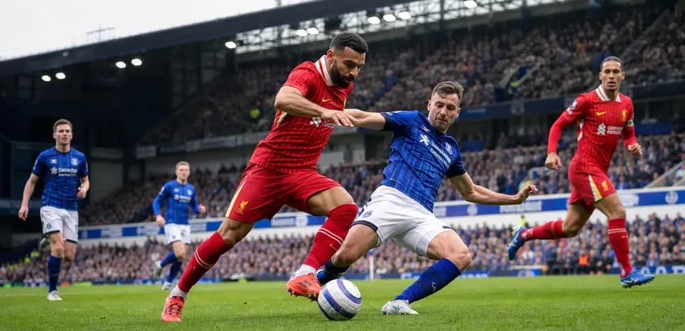 Liverpool and Everton players contesting for the ball