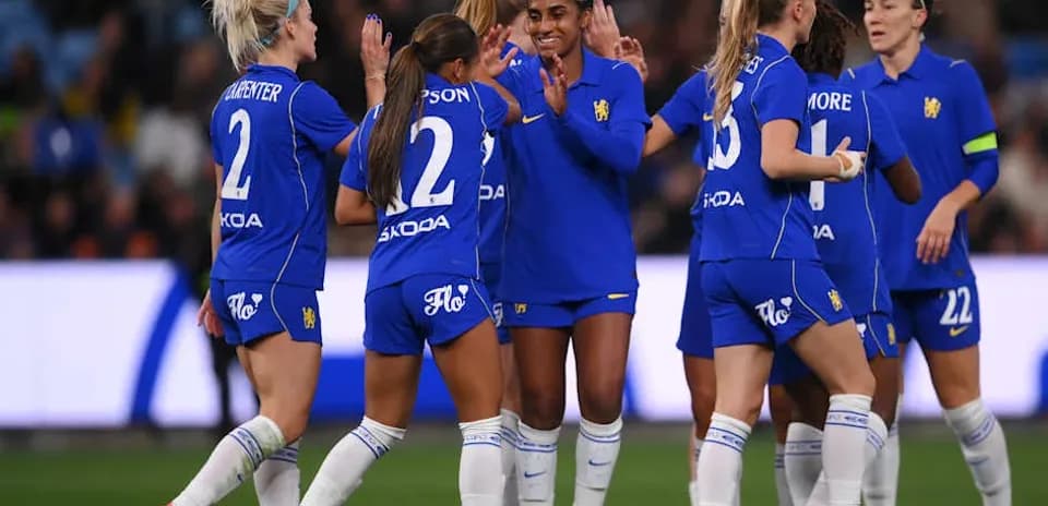 Players celebrating a goal during a match