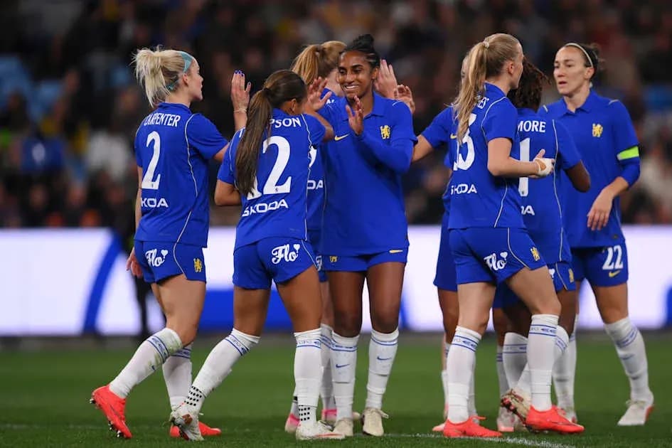 Players celebrating a goal during a match