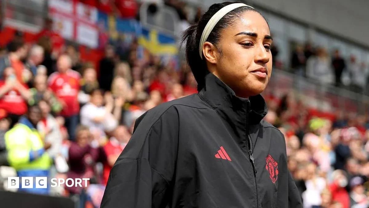 Player walking onto the pitch before the match