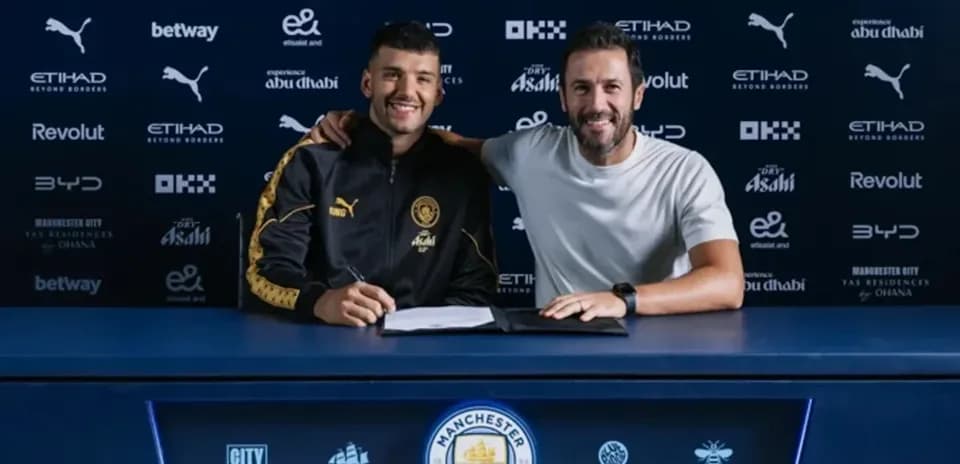 Player signing contract with club representative at table