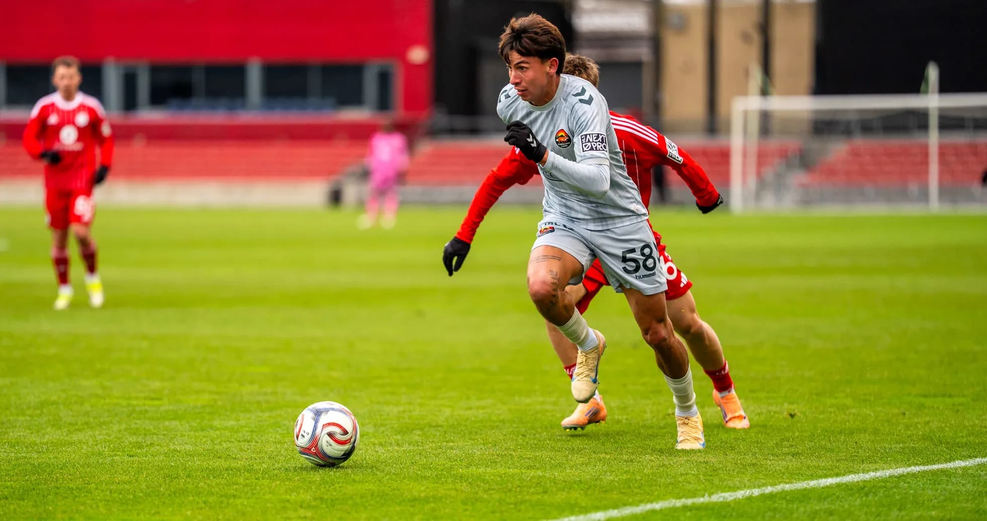 Player running with ball during Chicago Fire II match