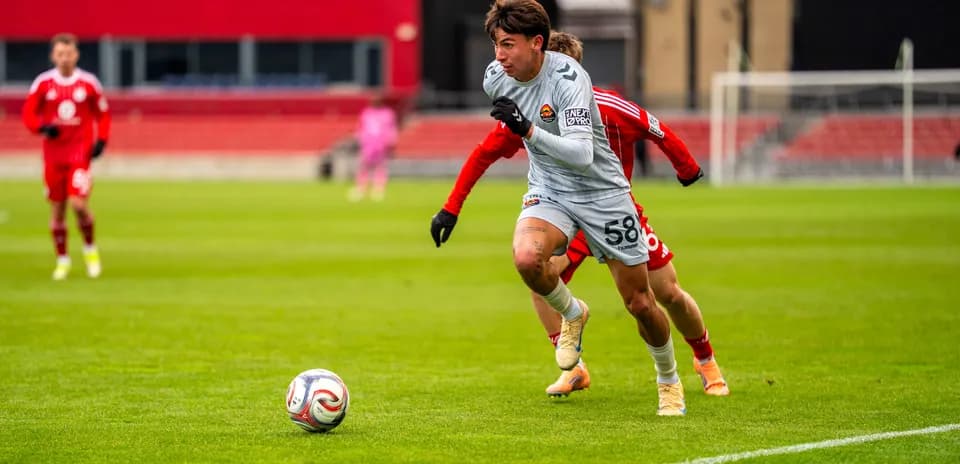 Player running with ball during Chicago Fire II match
