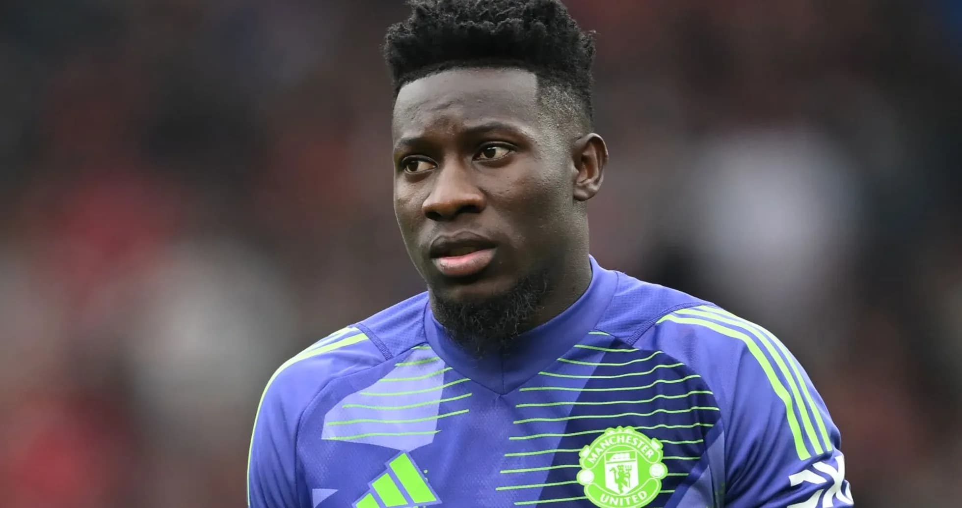 Goalkeeper wearing Manchester United kit on the field