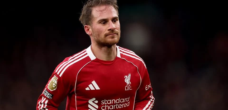 Player in Liverpool FC kit walking on the pitch