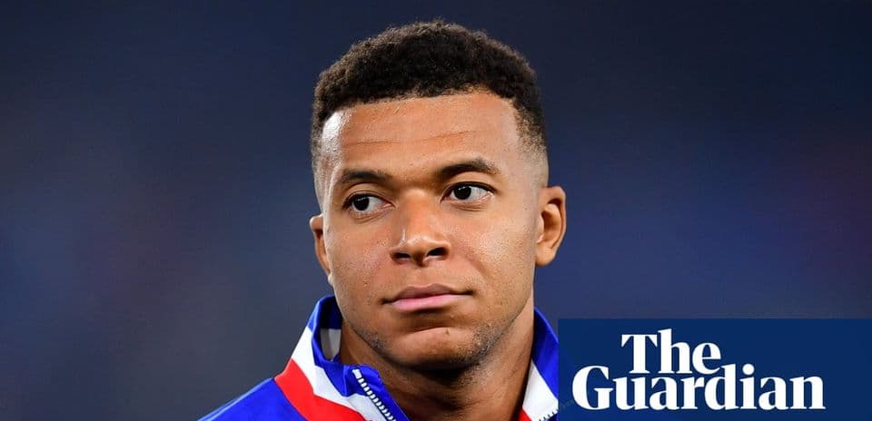 Player in team jacket looking off-camera
