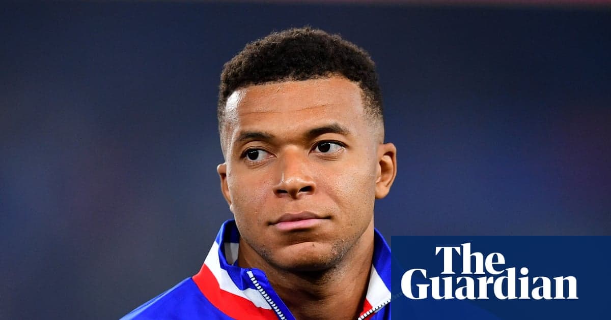 Player in team jacket looking off-camera