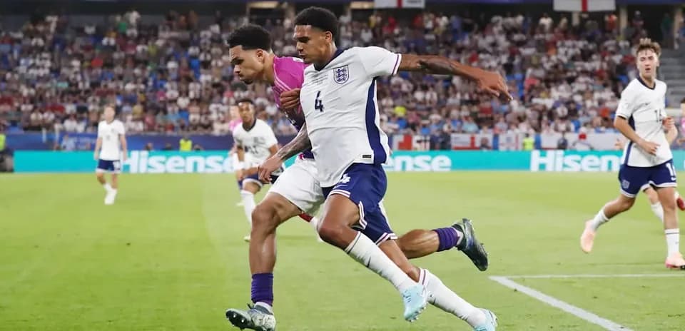 Two players contesting the ball during a match