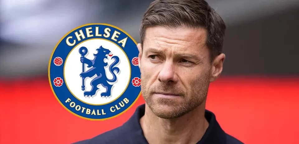 Man standing near Chelsea Football Club logo