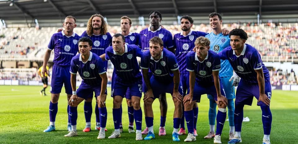 Louisville City FC team posing for a photo