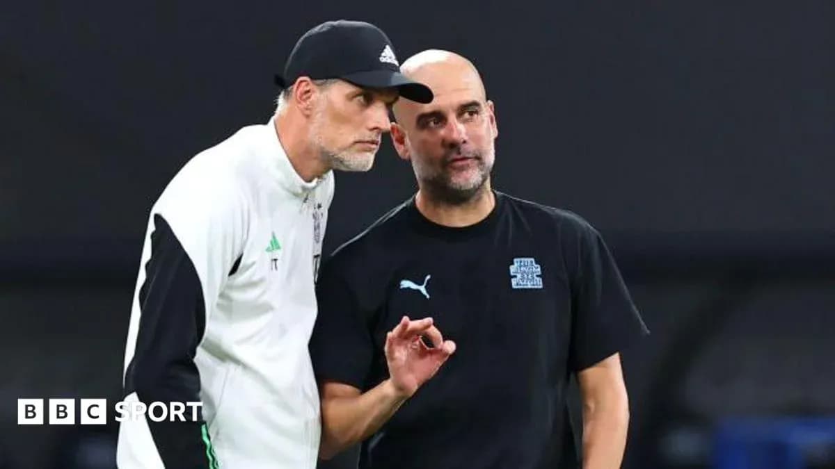 Two football managers discussing on the sidelines