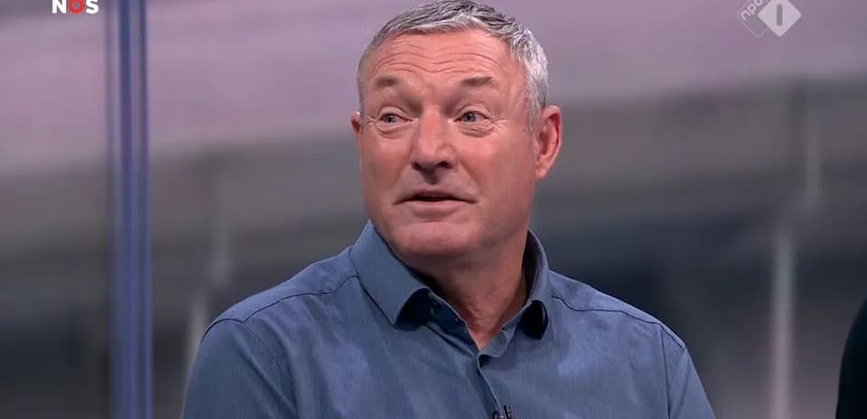 Sports analyst speaking during television broadcast