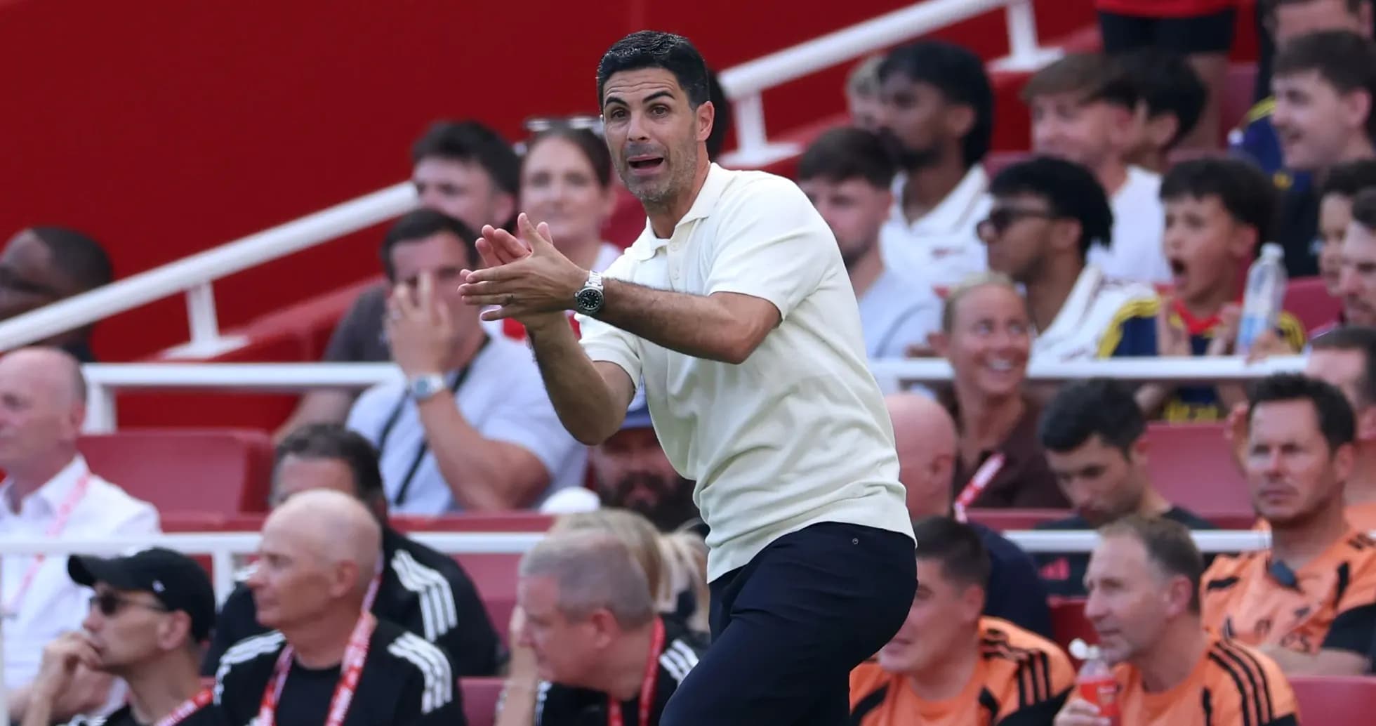 Manager gesturing from the sidelines during match