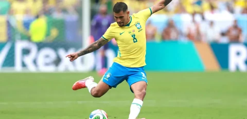 Brazilian player striking soccer ball during match