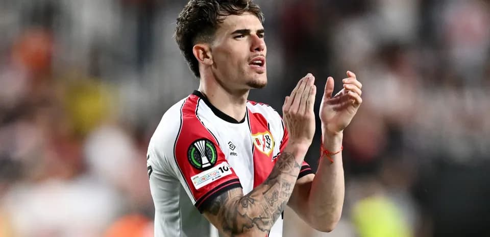 Player applauding fans after match in team jersey