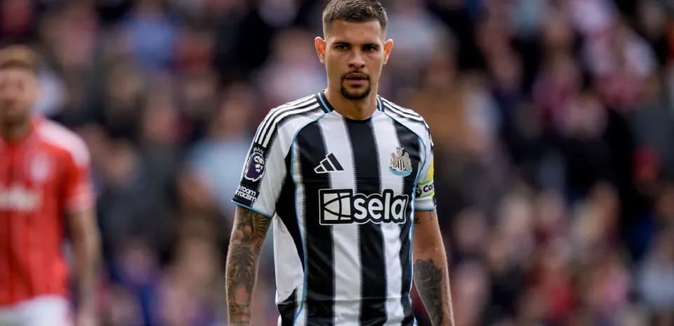 Newcastle player in black and white striped jersey
