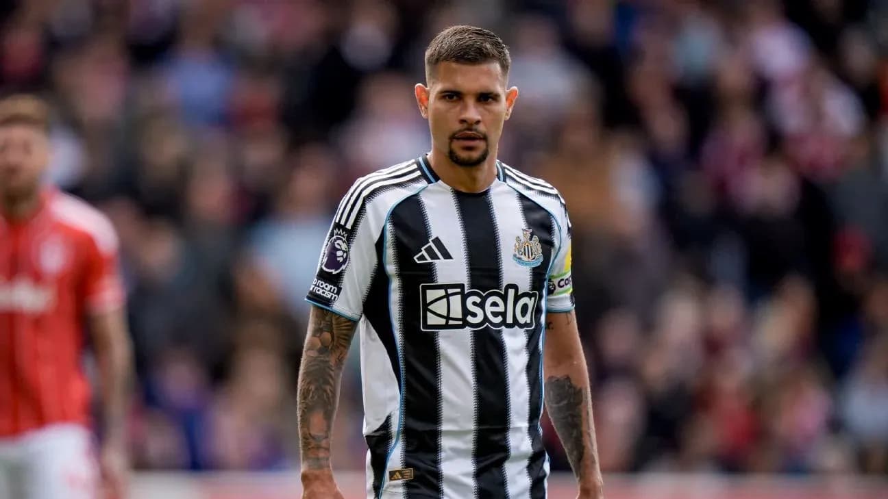 Newcastle player in black and white striped jersey