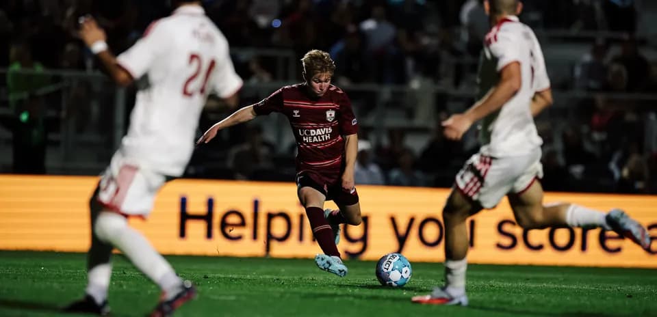 Player dribbling the ball during USL match