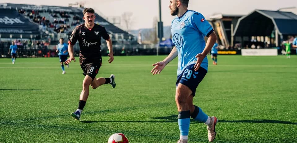 Player dribbling during HFX vs Vancouver match