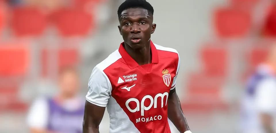 Monaco player in red and white kit on field