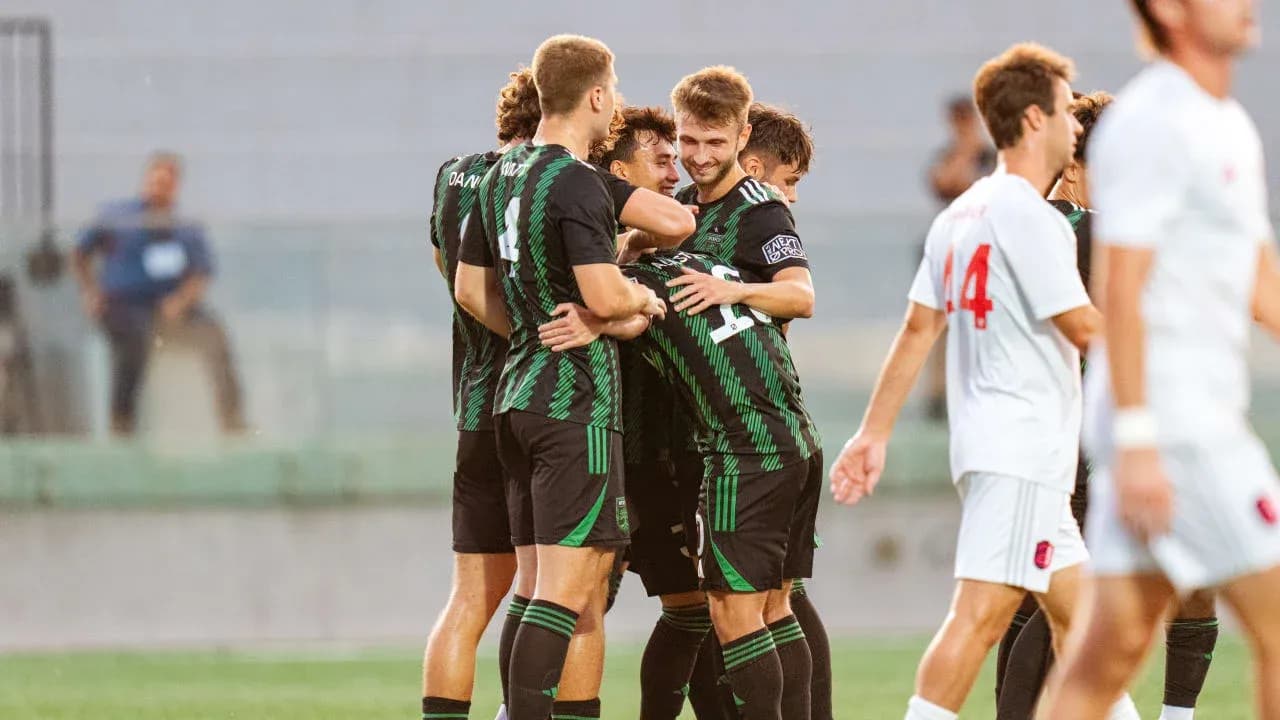 Players celebrating a goal during MLS Next Pro match