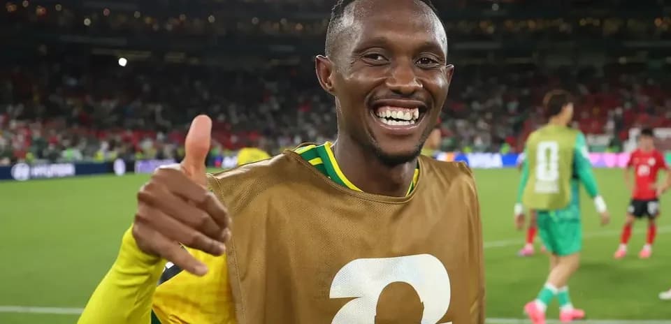 Player celebrating with thumbs up on the field