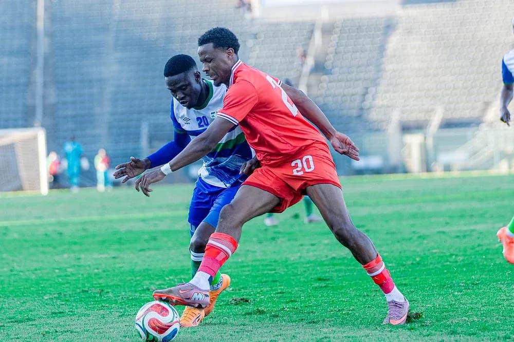 Two players competing for the ball during soccer match