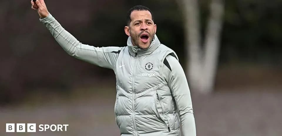 Coach directing players during training session