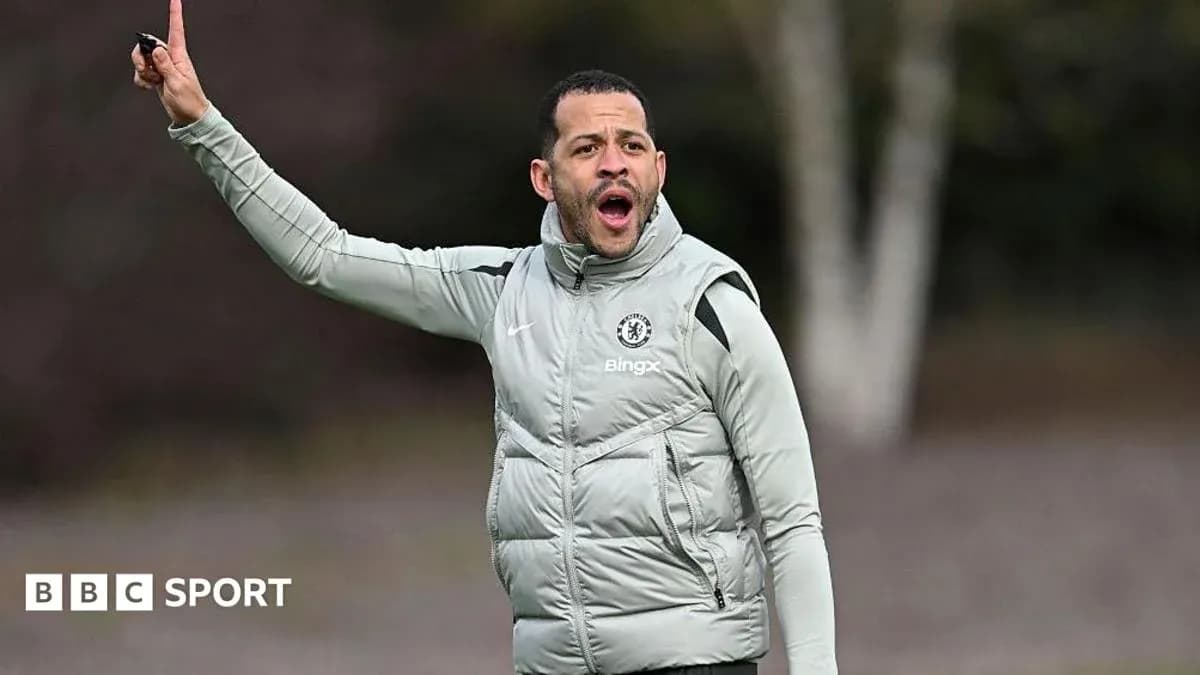 Coach directing players during training session