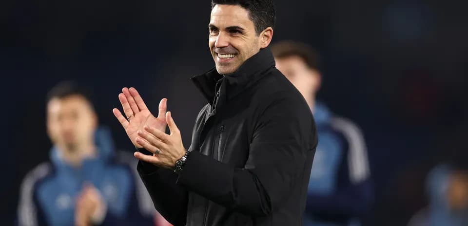 Manager clapping and smiling during match celebration