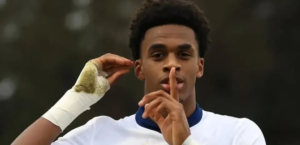 Player making a shushing gesture on the field