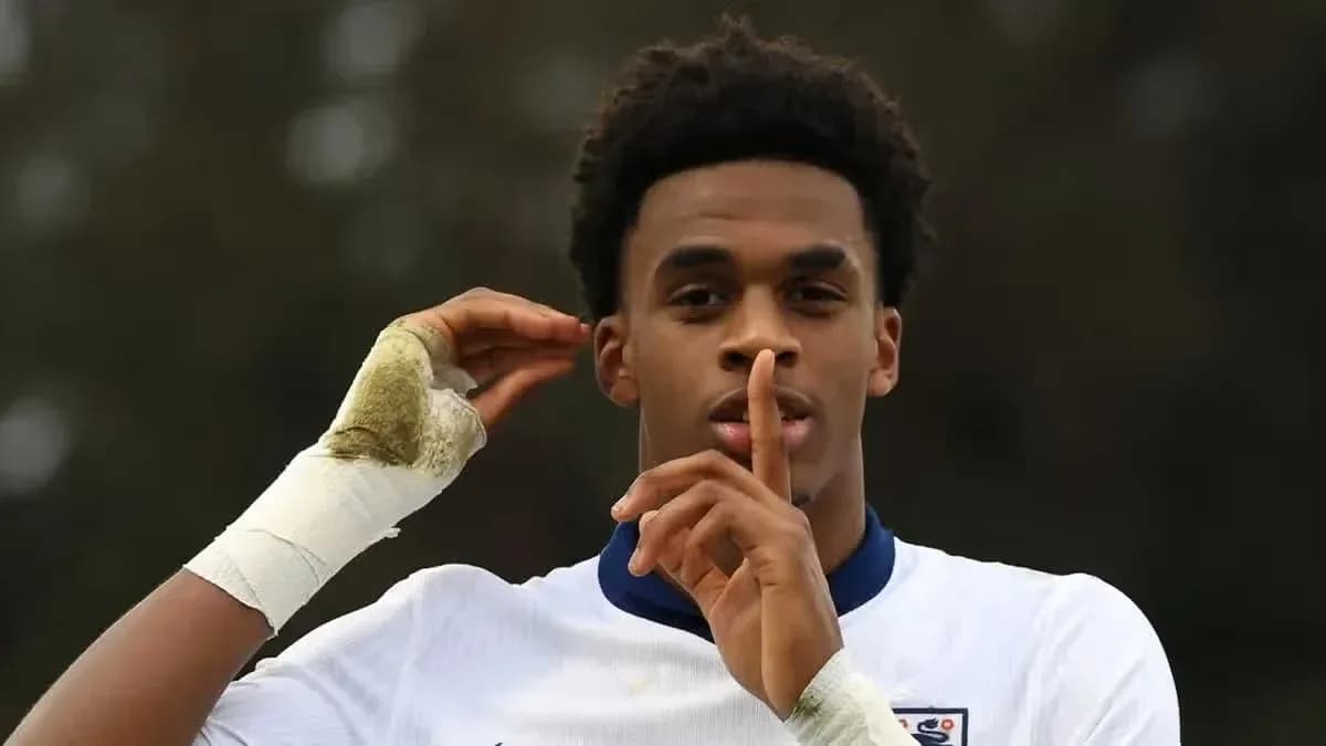 Player making a shushing gesture on the field