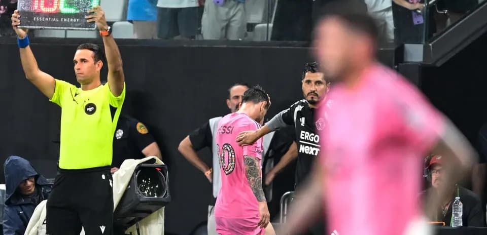 Substitution in progress with player exiting field