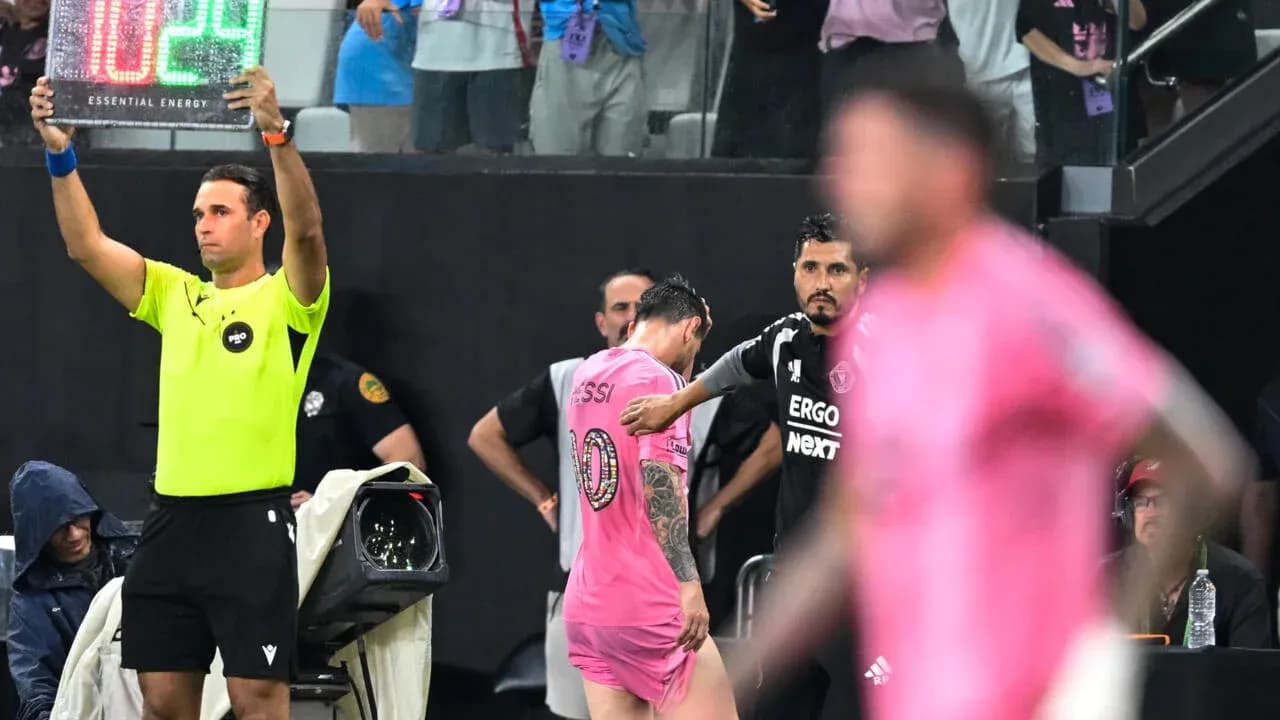Substitution in progress with player exiting field