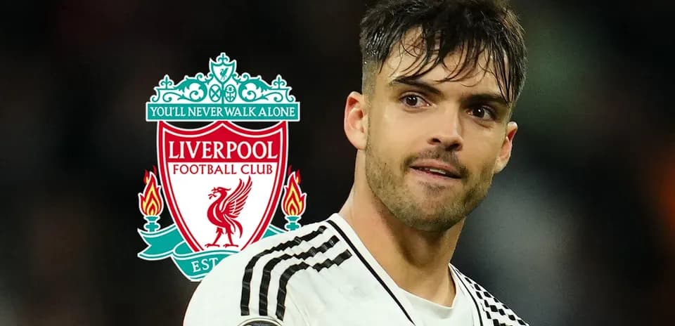 Player in front of Liverpool FC logo backdrop